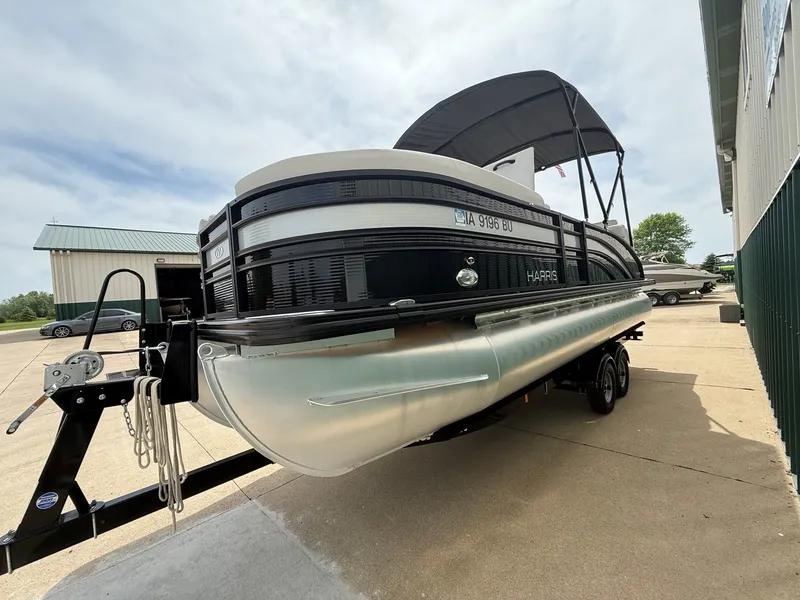 Slide: The Image of 2021 Harris Sunliner 230 pontoon boat on trailer, side view. - 3