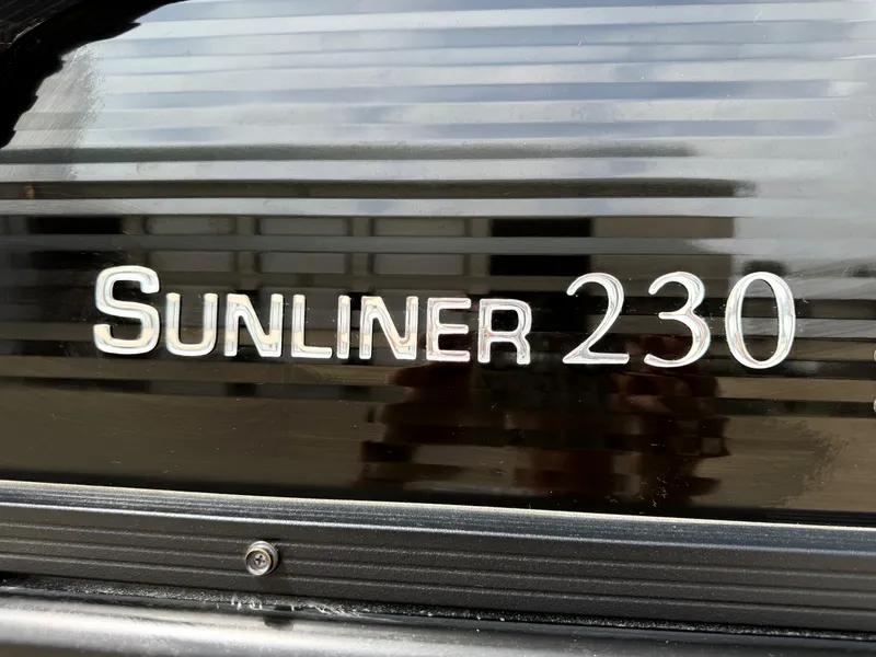 Slide: The Image of Harris Sunliner 230 emblem on black background, model year 2021. - 5