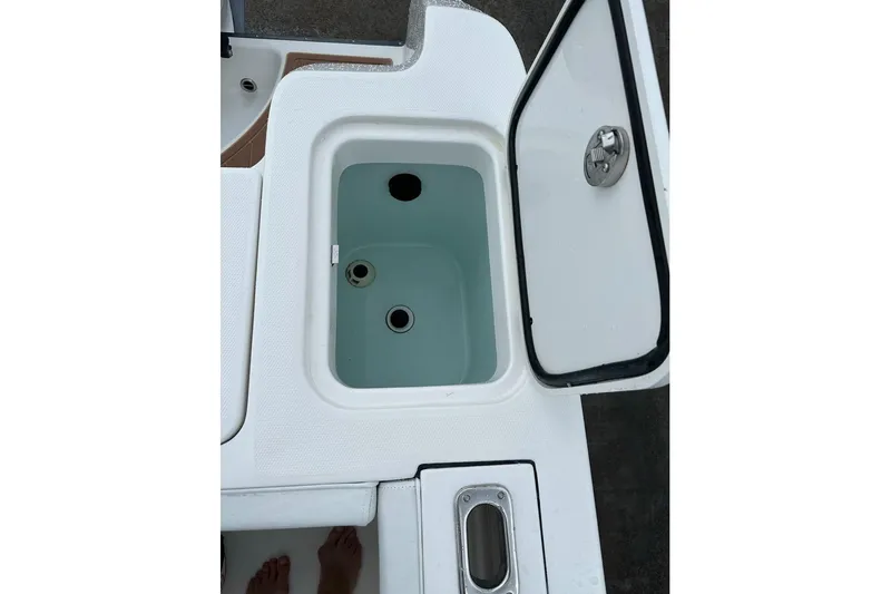 Slide: The Image of Edgewater 320CC 2018 boat cooler with open lid. - 25