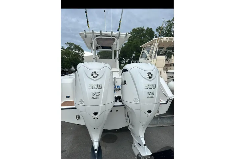 Slide: The Image of 2018 Edgewater 320CC with Yamaha 300 V6 outboard engines. - 32