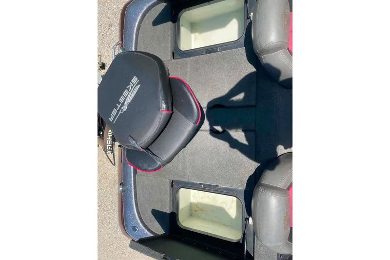 Slide: The Image of 2014 Skeeter ZX20 boat interior with seating and storage compartments. - 12