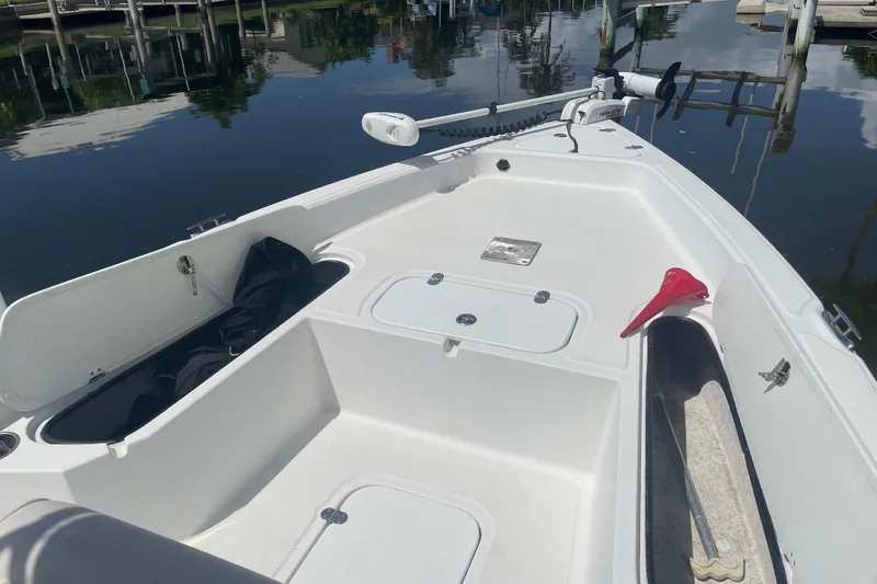Slide: The Image of 2015 Glasstream 228 TE boat interior with storage compartments and fishing gear. - 12