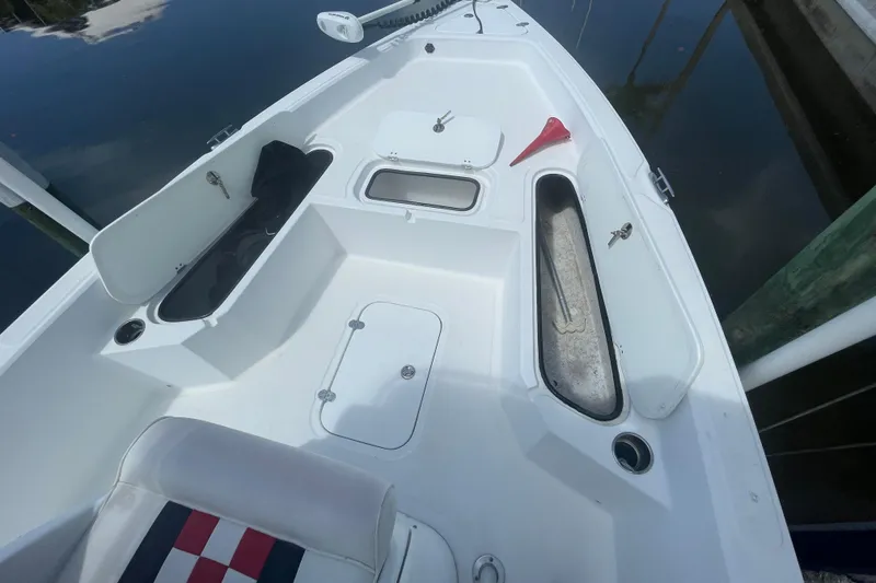 Slide: The Image of 2015 Glasstream 228 TE boat interior with storage compartments and seating. - 13