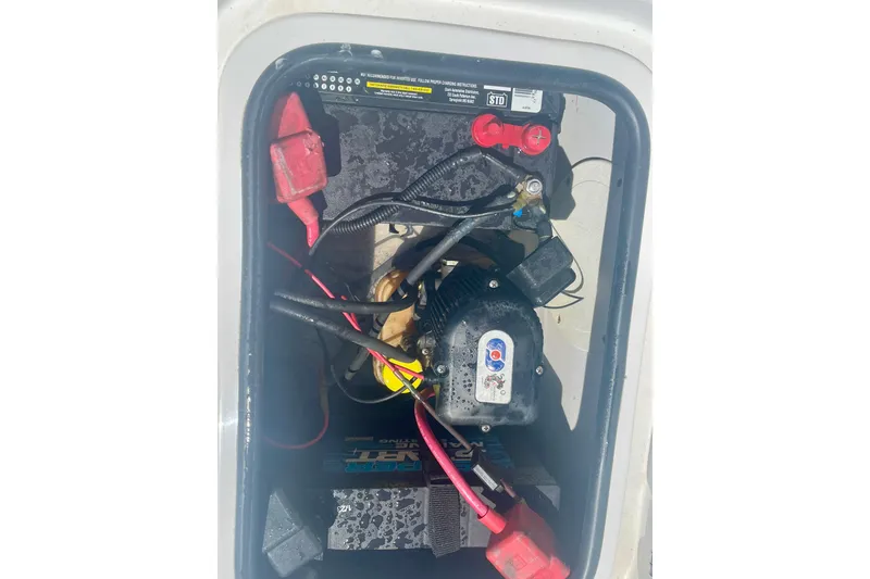 Slide: The Image of Battery compartment of a 2015 Glasstream 228 TE boat with visible wiring. - 5