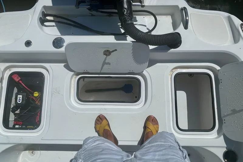 Slide: The Image of Interior view of a 2015 Glasstream 228 TE boat showing storage compartments and equipment. - 6