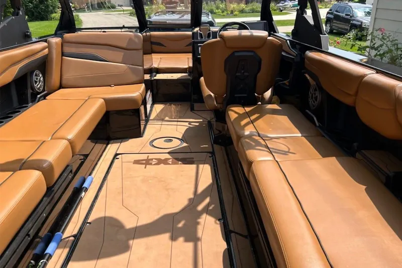 Slide: The Image of 2022 Axis T250 boat interior with tan leather seating and modern design. - 3