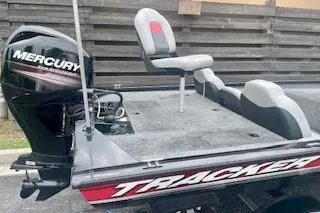 Slide: The Image of 2016 Tracker Pro Team 175 TXW boat with Mercury engine, featuring comfortable seating. - 12