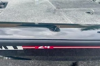 Slide: The Image of 2016 Tracker Pro Team 175 TXW boat detail with sleek black and red design. - 16