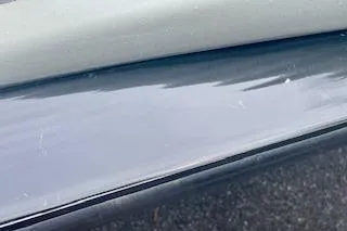 Slide: The Image of Close-up of a 2016 Tracker Pro Team 175 TXW boat surface. - 18