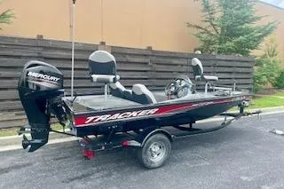 Slide: The Image of 2016 Tracker Pro Team 175 TXW fishing boat with Mercury outboard motor on trailer. - 3