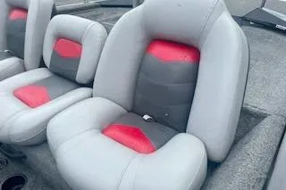 Slide: The Image of 2016 Tracker Pro Team 175 TXW boat seats with gray and red upholstery. - 9