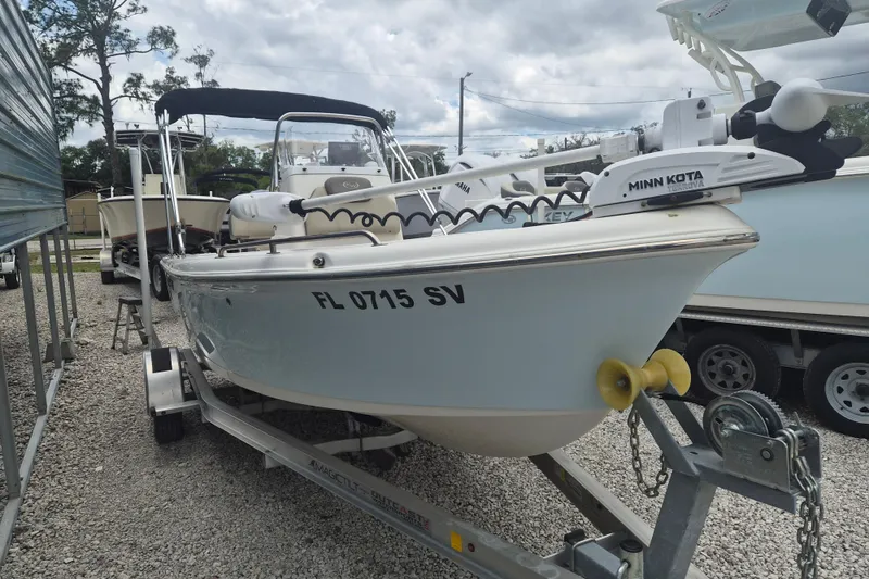 The Image of 2021 Key West 1720 Center Console boat on trailer, featuring Minn Kota trolling motor. - 1