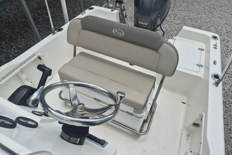 Slide: The Image of 2021 Key West 1720 Center Console boat interior with steering wheel and seating. - 10