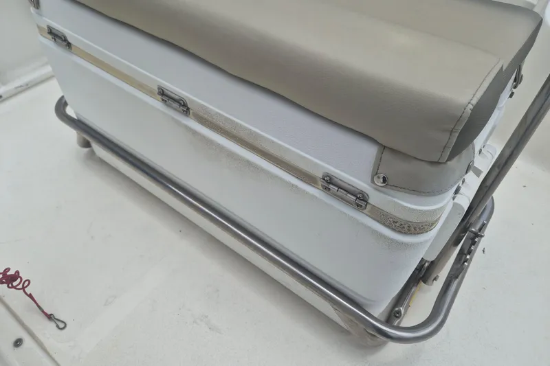 Slide: The Image of 2021 Key West 1720 Center Console boat seat with cushioned top and metal frame. - 11