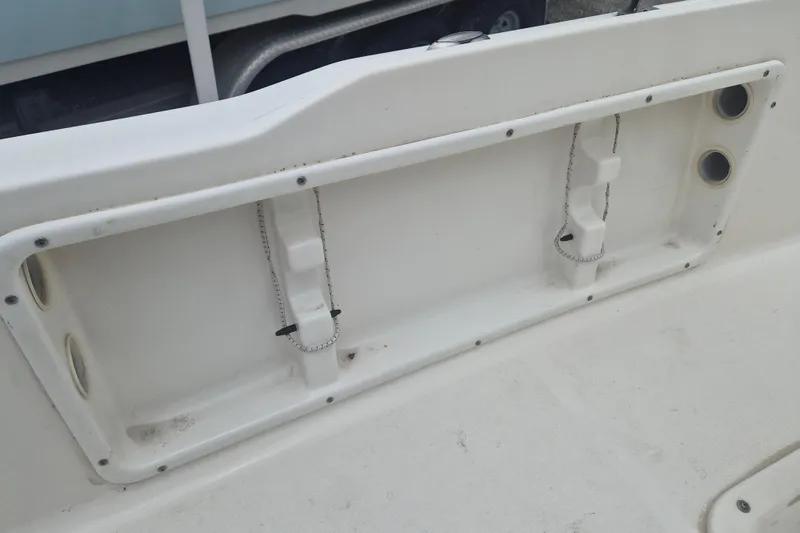 Slide: The Image of Key West 1720 Center Console 2021 boat interior detail with storage compartment. - 15