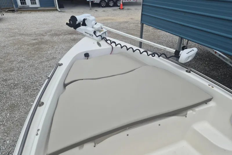 Slide: The Image of 2021 Key West 1720 Center Console boat with Minn Kota trolling motor on deck. - 16