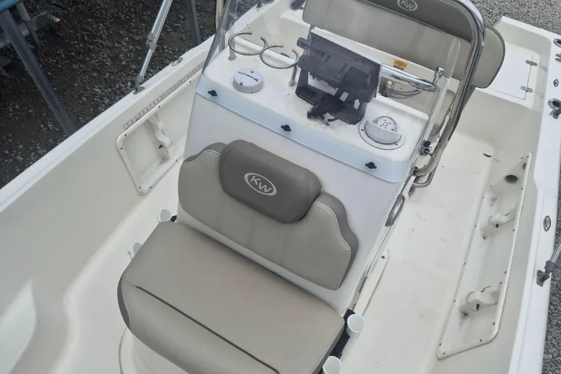 Slide: The Image of 2021 Key West 1720 Center Console boat interior with seating and console controls. - 17