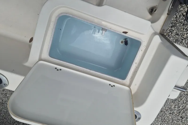 Slide: The Image of Open storage compartment on a 2021 Key West 1720 Center Console boat. - 8