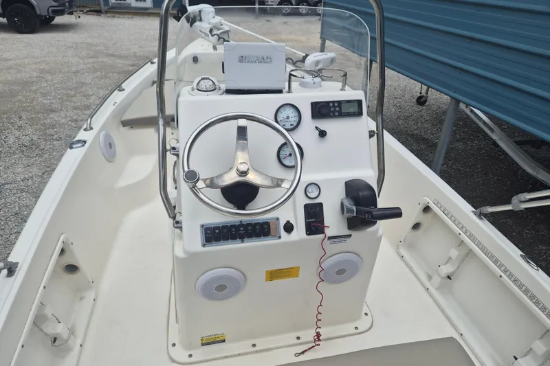 Slide: The Image of 2021 Key West 1720 Center Console boat interior with steering wheel and controls. - 9