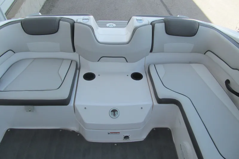 Slide: The Image of 2024 Yamaha Boats SX190 interior seating with cup holders and sleek design. - 13