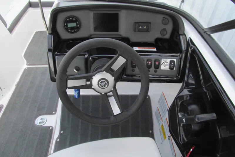 Slide: The Image of 2024 Yamaha Boats SX190 steering console with modern controls and sleek design. - 6