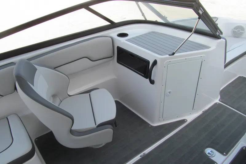 Slide: The Image of 2024 Yamaha Boats SX190 interior with sleek seating and modern dashboard design. - 7
