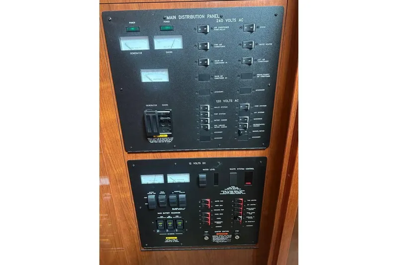 Slide: The Image of Electrical control panel on a 2004 Sea Ray 390 Motor Yacht, featuring AC and DC systems. - 12