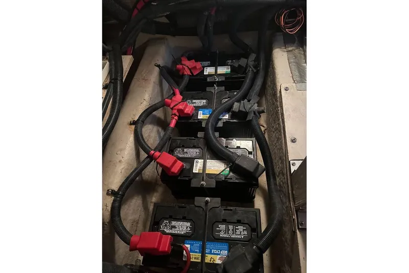 Slide: The Image of Battery compartment of a 2004 Sea Ray 390 Motor Yacht with connected cables. - 17
