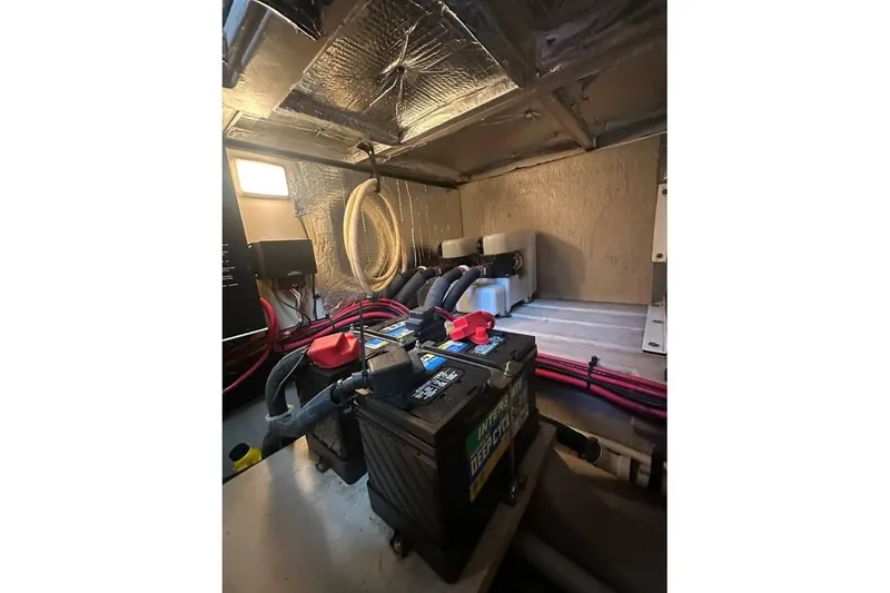 Slide: The Image of Engine room of 2004 Sea Ray 390 Motor Yacht with battery and wiring. - 18