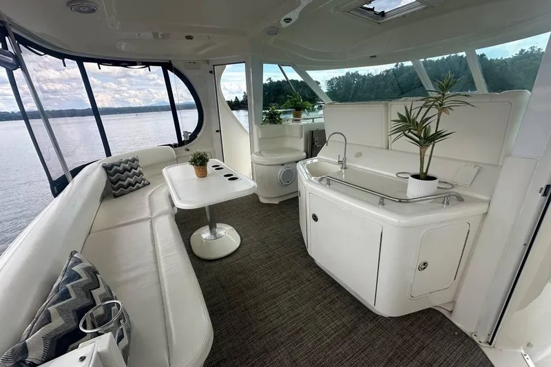 Slide: The Image of Luxurious interior of 2004 Sea Ray 390 Motor Yacht with elegant seating and scenic views. - 2