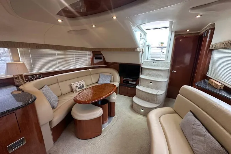 Slide: The Image of Luxurious interior of 2004 Sea Ray 390 Motor Yacht with plush seating and elegant decor. - 3