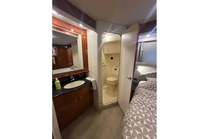 Slide: The Image of Interior of 2004 Sea Ray 390 Motor Yacht with bathroom and bedroom view. - 7