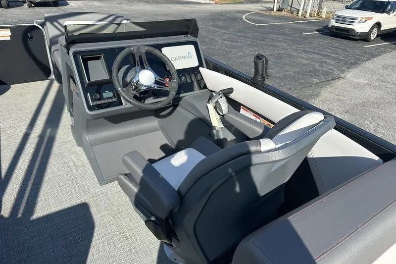 Slide: The Image of 2024 Manitou Cruise 22 Max Bench V-Toon helm with Garmin display and steering wheel. - 13