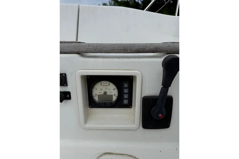 Slide: The Image of Control panel of a 2014 Beneteau FIRST 25 S sailboat with throttle and gauge. - 11