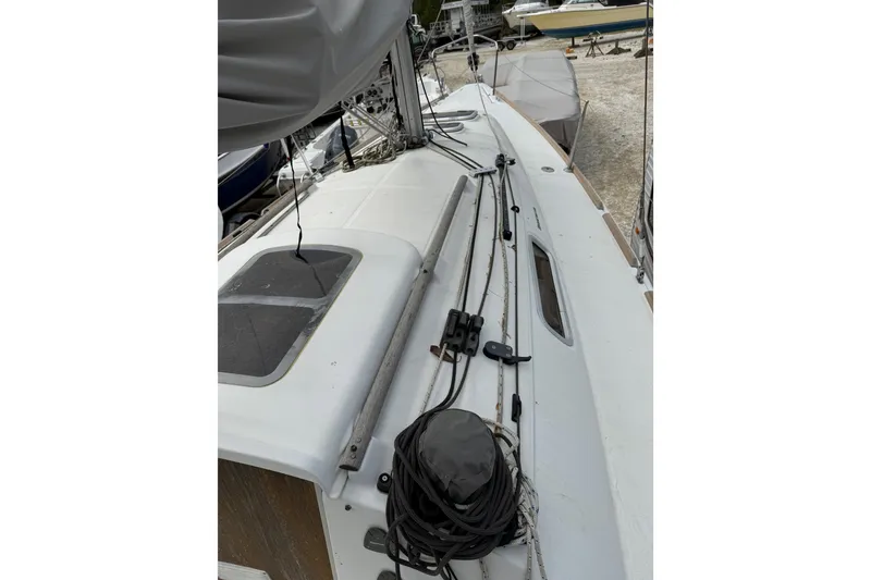Slide: The Image of 2014 Beneteau FIRST 25 S sailboat deck with rigging and hatch details. - 13
