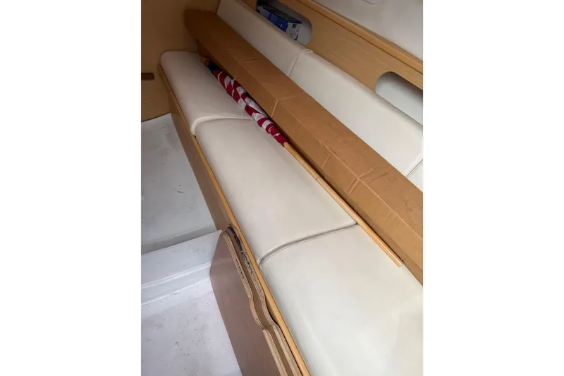 Slide: The Image of Interior seating of 2014 Beneteau FIRST 25 S sailboat with storage space. - 24