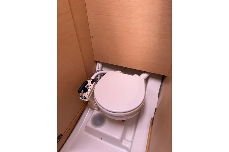 Slide: The Image of Compact marine toilet in 2014 Beneteau FIRST 25 S sailboat bathroom. - 26