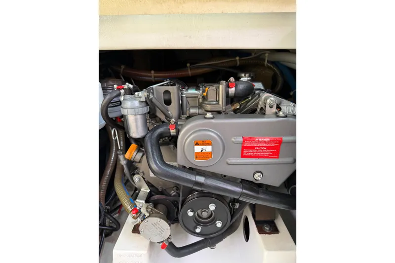 Slide: The Image of Engine compartment of a 2014 Beneteau FIRST 25 S sailboat, showcasing mechanical components. - 30