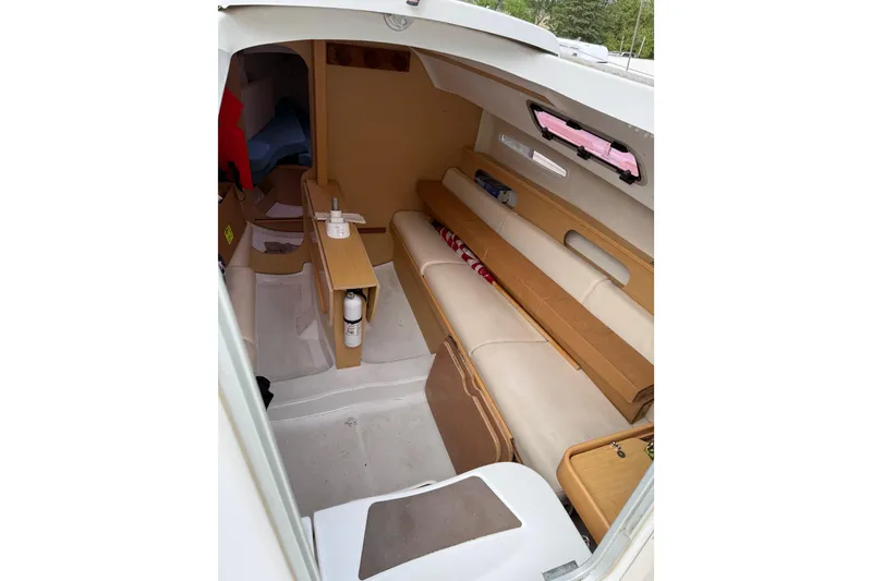 Slide: The Image of Interior of 2014 Beneteau FIRST 25 S sailboat, featuring seating and storage areas. - 34