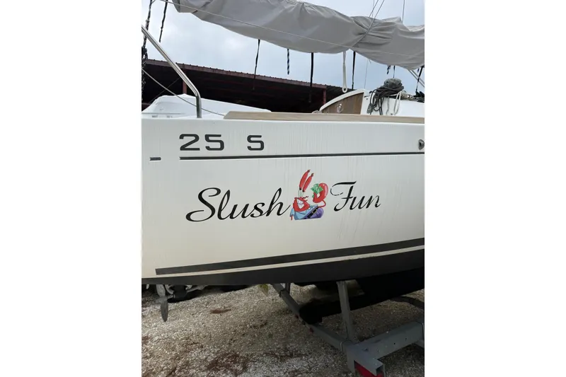 Slide: The Image of 2014 Beneteau FIRST 25 S sailboat with "Slush Fun" graphic on hull. - 36