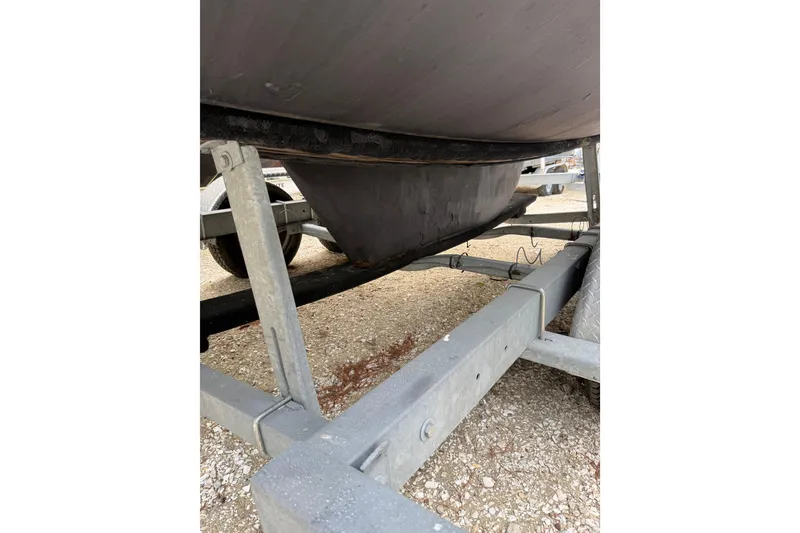Slide: The Image of 2014 Beneteau FIRST 25 S sailboat keel on trailer, close-up view. - 37