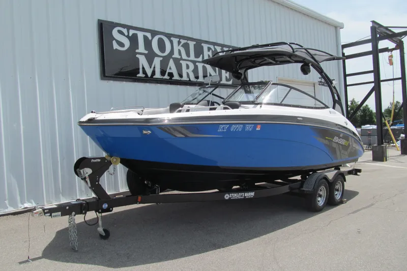 Slide: The Image of 2017 Yamaha Boats 242X E-Series in blue on trailer at Stokley's Marine. - 1