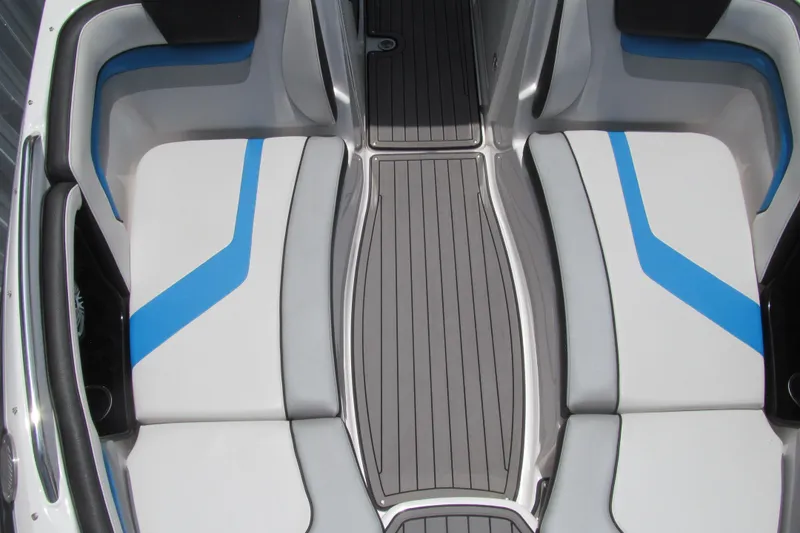 Slide: The Image of 2017 Yamaha Boats 242X E-Series interior seating with blue accents and sleek design. - 8