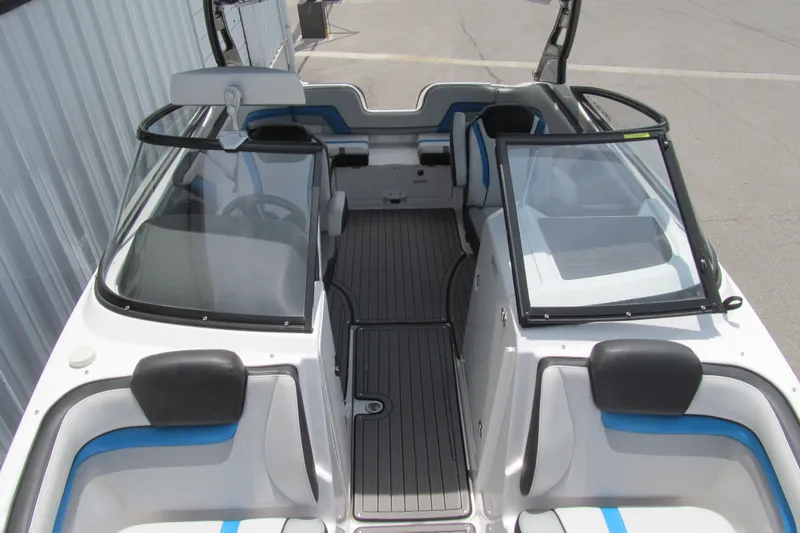 Slide: The Image of 2017 Yamaha Boats 242X E-Series interior with seating and windshield view. - 9