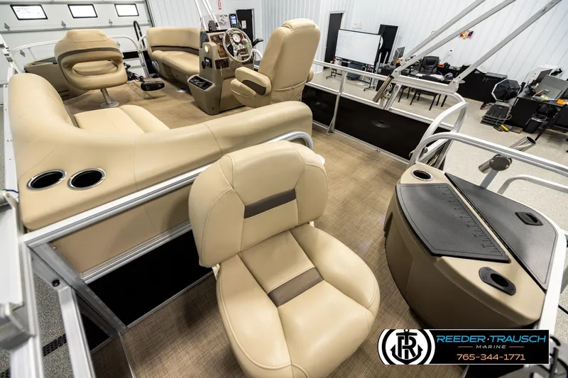Slide: The Image of Interior of 2022 SUNTRACKER BASS BUGGY 18 DLX pontoon boat with beige seating. - 11