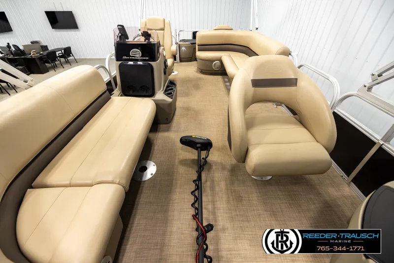 Slide: The Image of 2022 SUNTRACKER BASS BUGGY 18 DLX pontoon boat interior with beige seating. - 13