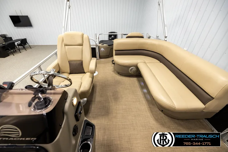 Slide: The Image of Interior of 2022 SUNTRACKER BASS BUGGY 18 DLX pontoon boat with beige seating. - 14