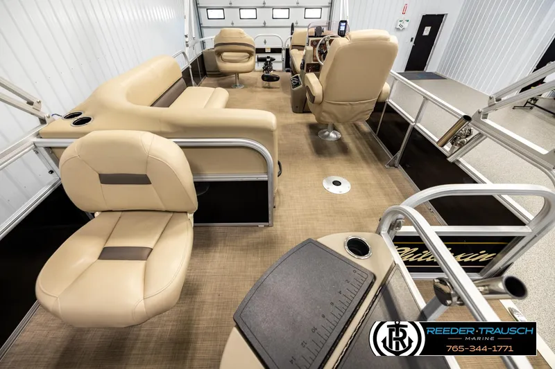 Slide: The Image of 2022 SUNTRACKER BASS BUGGY 18 DLX pontoon boat interior with beige seating and helm. - 16