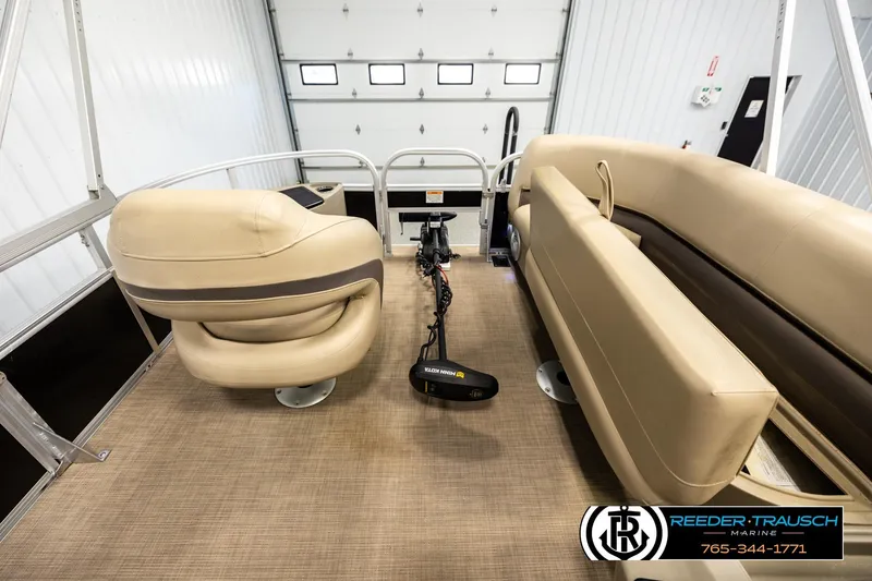 Slide: The Image of Interior of 2022 SUNTRACKER BASS BUGGY 18 DLX pontoon boat with beige seating. - 19