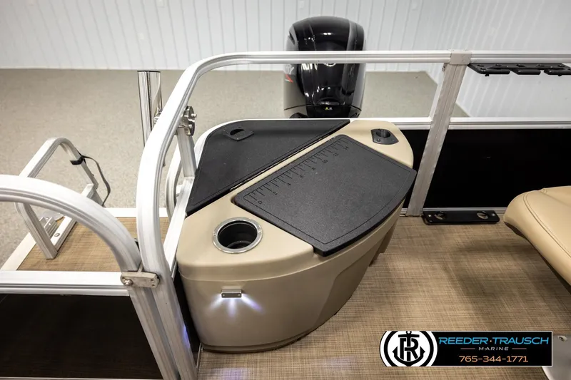 Slide: The Image of 2022 SUNTRACKER BASS BUGGY 18 DLX boat interior with console and seating. - 22